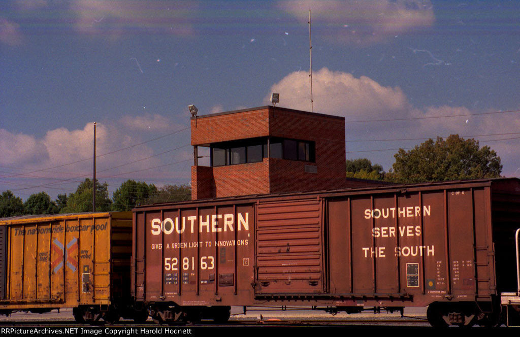 SOU 528163 passes in front of the Glenwood Yard tower